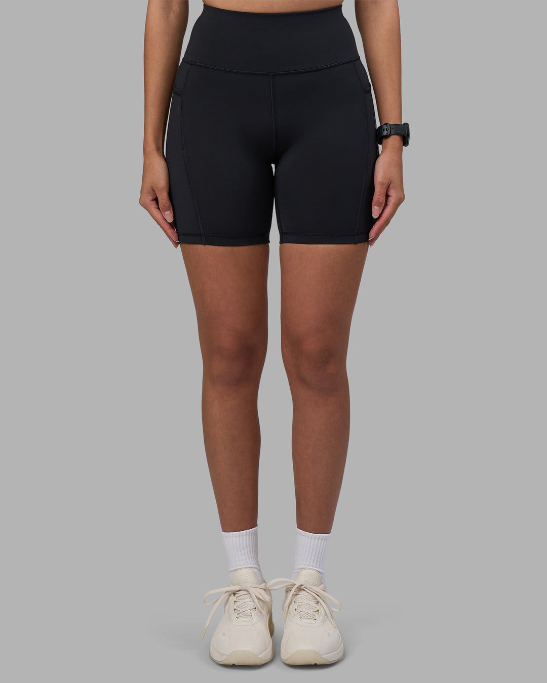 Woman wearing Rep Ultra High-Rise 6&quot; Short Pockets - Black-Power Cobalt | Model:Rhiley | Size:S