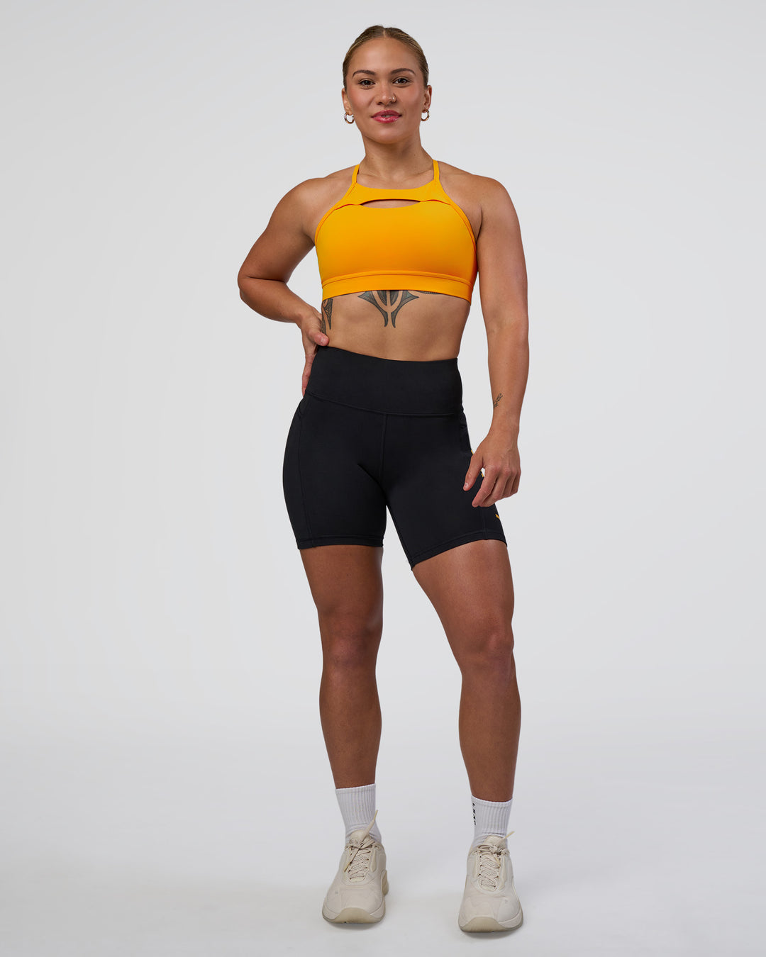 Woman wearing Rep Ultra High-Rise 6" Short Pockets - Black-Zinnia | Model:Tenaya | Size:S