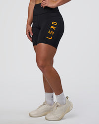 Woman wearing Rep Ultra High-Rise 6" Short Pockets - Black-Zinnia | Model:Tenaya | Size:S