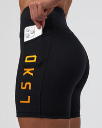 Woman wearing Rep Ultra High-Rise 6" Short Pockets - Black-Zinnia | Model:Tenaya | Size:S