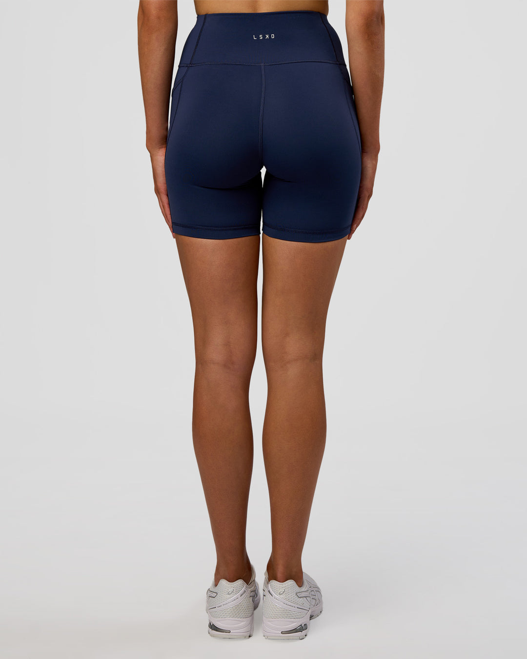 Woman wearing Rep Ultra High-Rise 6" Short Pockets - Future Navy-White | Model:Evie | Size:S