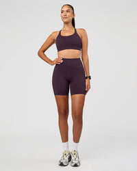 Woman wearing Rep Ultra High-Rise 6" Short Pockets - Midnight Plum-Marshmallow | Model:Rhiley | Size:S