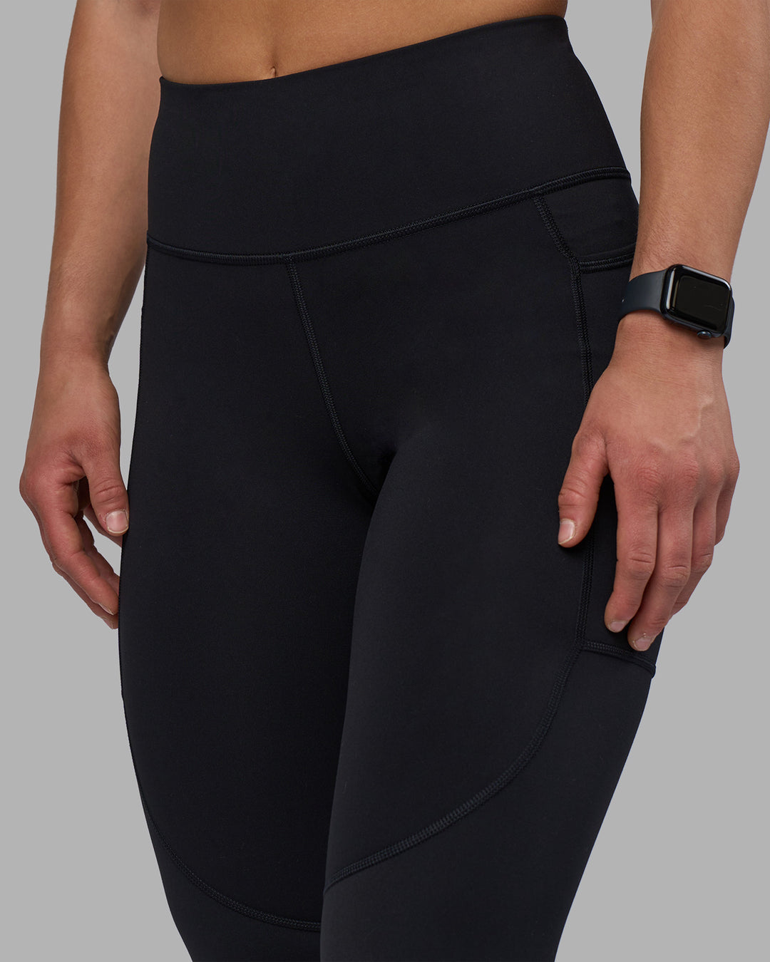 Woman wearing Rep Ultra High-Rise 7/8 Legging Pockets - Black-Candy Pink | Model:Keisha | Size:S