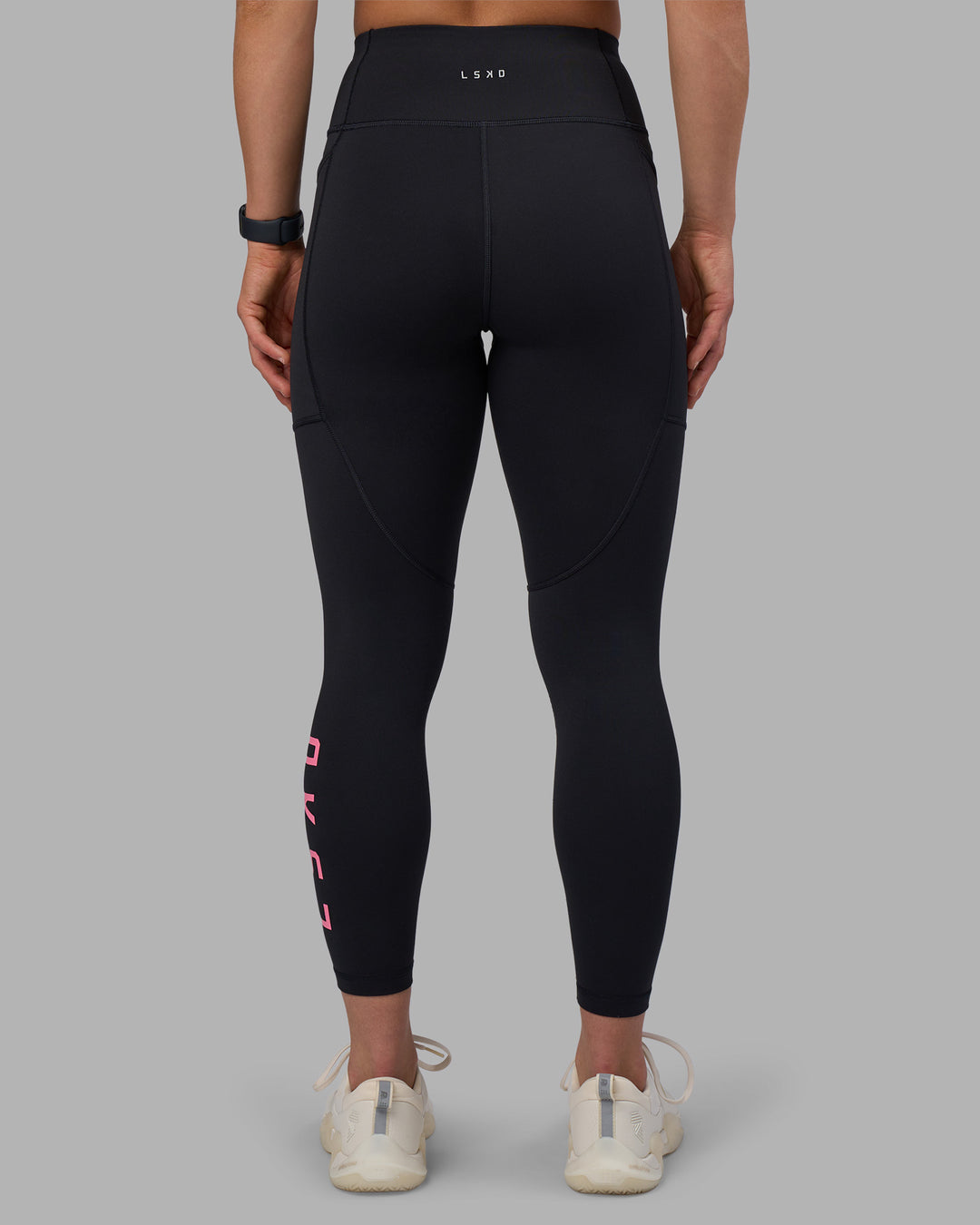 Woman wearing Rep Ultra High-Rise 7/8 Legging Pockets - Black-Candy Pink | Model:Keisha | Size:S