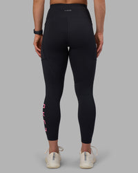 Woman wearing Rep Ultra High-Rise 7/8 Legging Pockets - Black-Candy Pink | Model:Keisha | Size:S