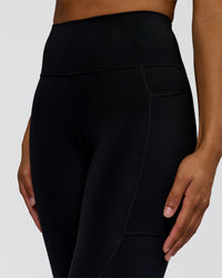 Woman wearing Rep Ultra High-Rise 7/8 Legging Pockets - Black-Marshmallow | Model:Rosie | Size:S