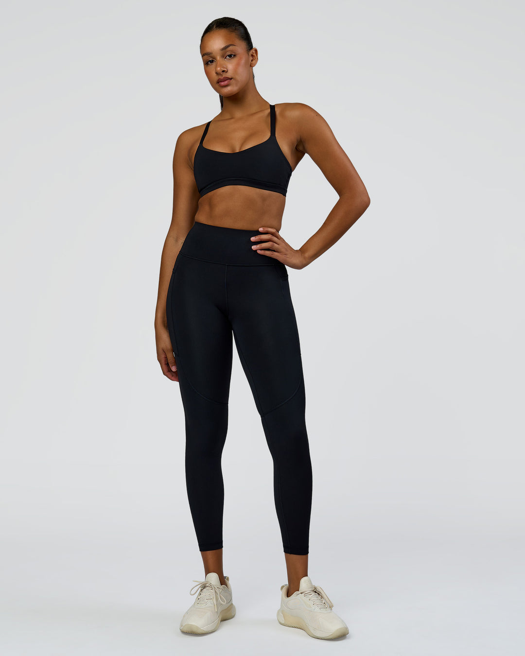 Woman wearing Rep Ultra High-Rise 7/8 Legging Pockets - Black-Palace Blue | Model:Rosie | Size:S