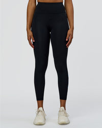 Woman wearing Rep Ultra High-Rise 7/8 Legging Pockets - Black-Palace Blue | Model:Rosie | Size:S
