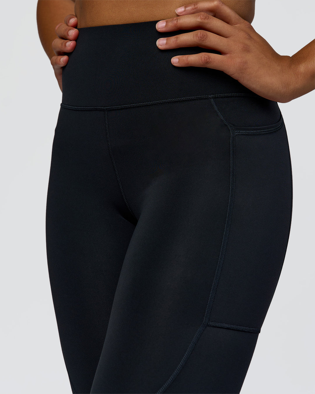 Woman wearing Rep Ultra High-Rise 7/8 Legging Pockets - Black-Palace Blue | Model:Rosie | Size:S