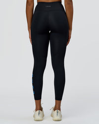 Woman wearing Rep Ultra High-Rise 7/8 Legging Pockets - Black-Palace Blue | Model:Rosie | Size:S