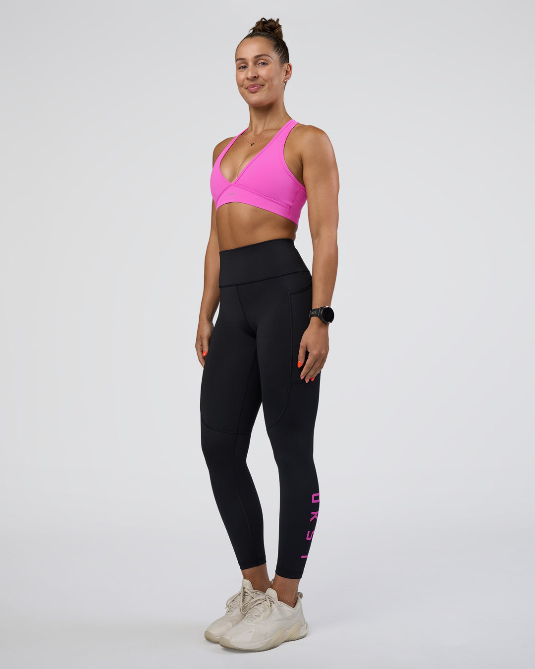Woman wearing Rep Ultra High-Rise 7/8 Legging Pockets - Black-Ultra Fuchsia | Model:Abbey | Size:S