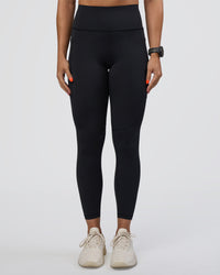 Woman wearing Rep Ultra High-Rise 7/8 Legging Pockets - Black-Ultra Fuchsia | Model:Abbey | Size:S