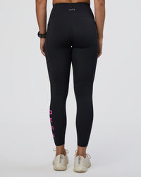Woman wearing Rep Ultra High-Rise 7/8 Legging Pockets - Black-Ultra Fuchsia | Model:Abbey | Size:S