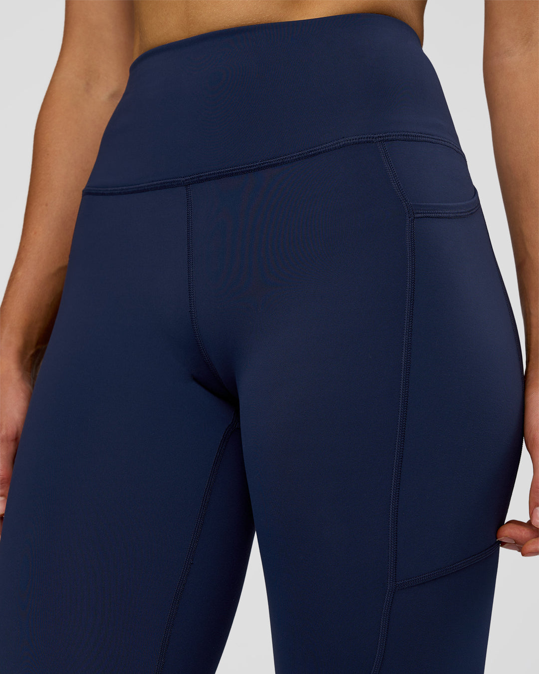 Woman wearing Rep Ultra High-Rise 7/8 Legging Pockets - Future Navy-White | Model:Evie | Size:S