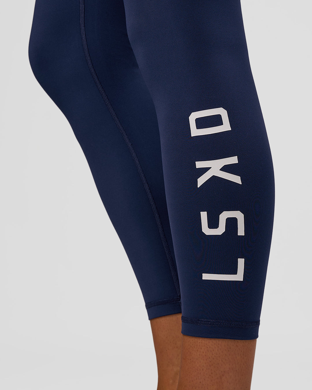 Woman wearing Rep Ultra High-Rise 7/8 Legging Pockets - Future Navy-White | Model:Evie | Size:S
