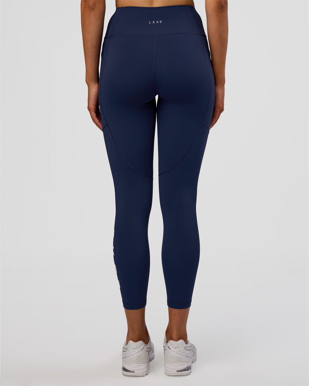 Woman wearing Rep Ultra High-Rise 7/8 Legging Pockets - Future Navy-White | Model:Evie | Size:S