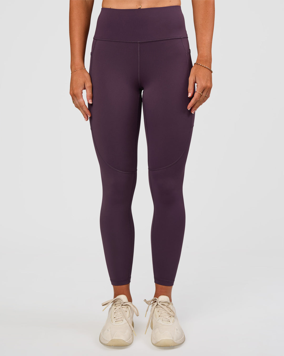 Woman wearing Rep Ultra High-Rise 7/8 Legging Pockets - Midnight Plum-Marshmallow | Model:Emelia | Size:S