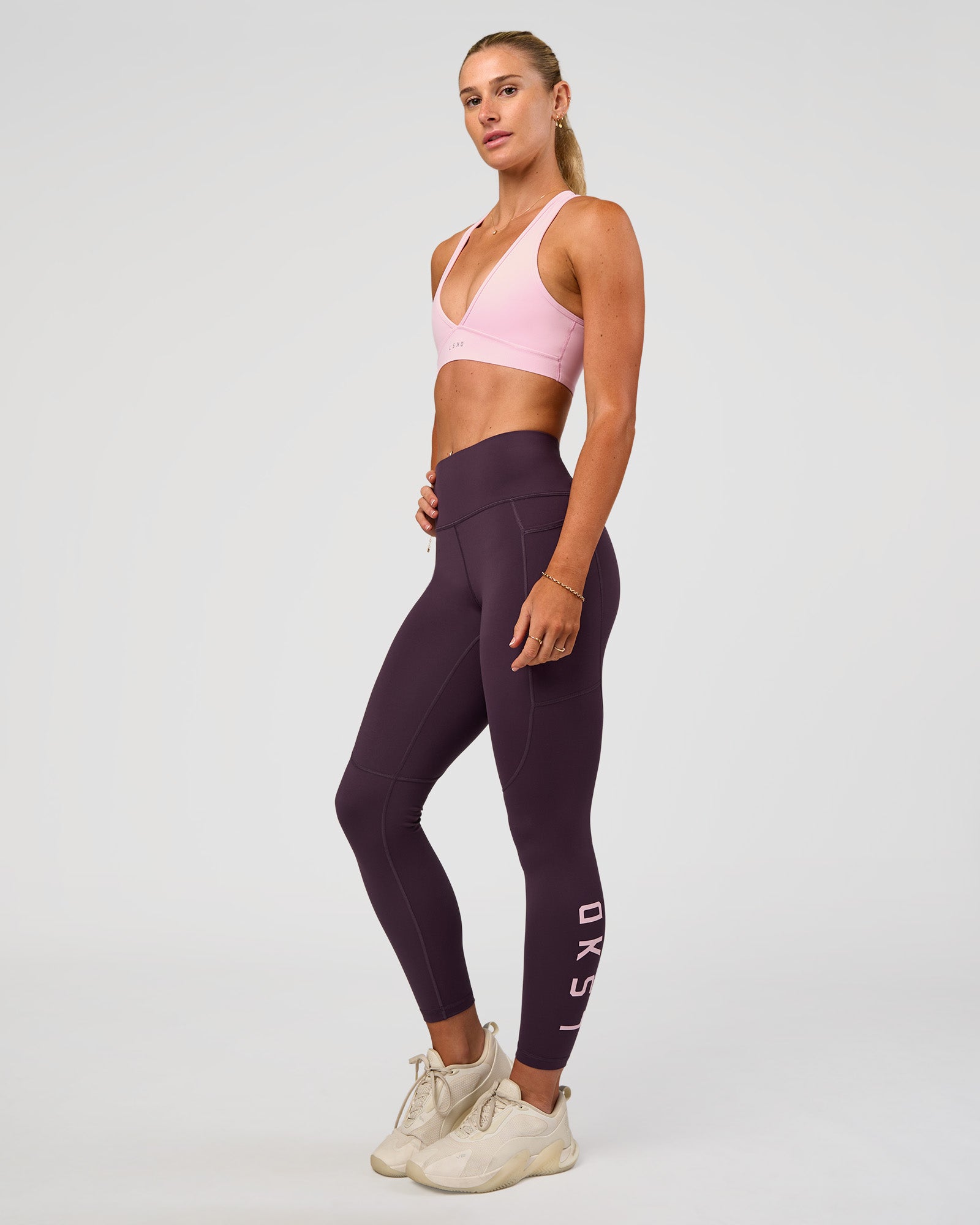 Woman wearing Rep Ultra High-Rise 7/8 Legging Pockets - Midnight Plum-Marshmallow | Model:Emelia | Size:S