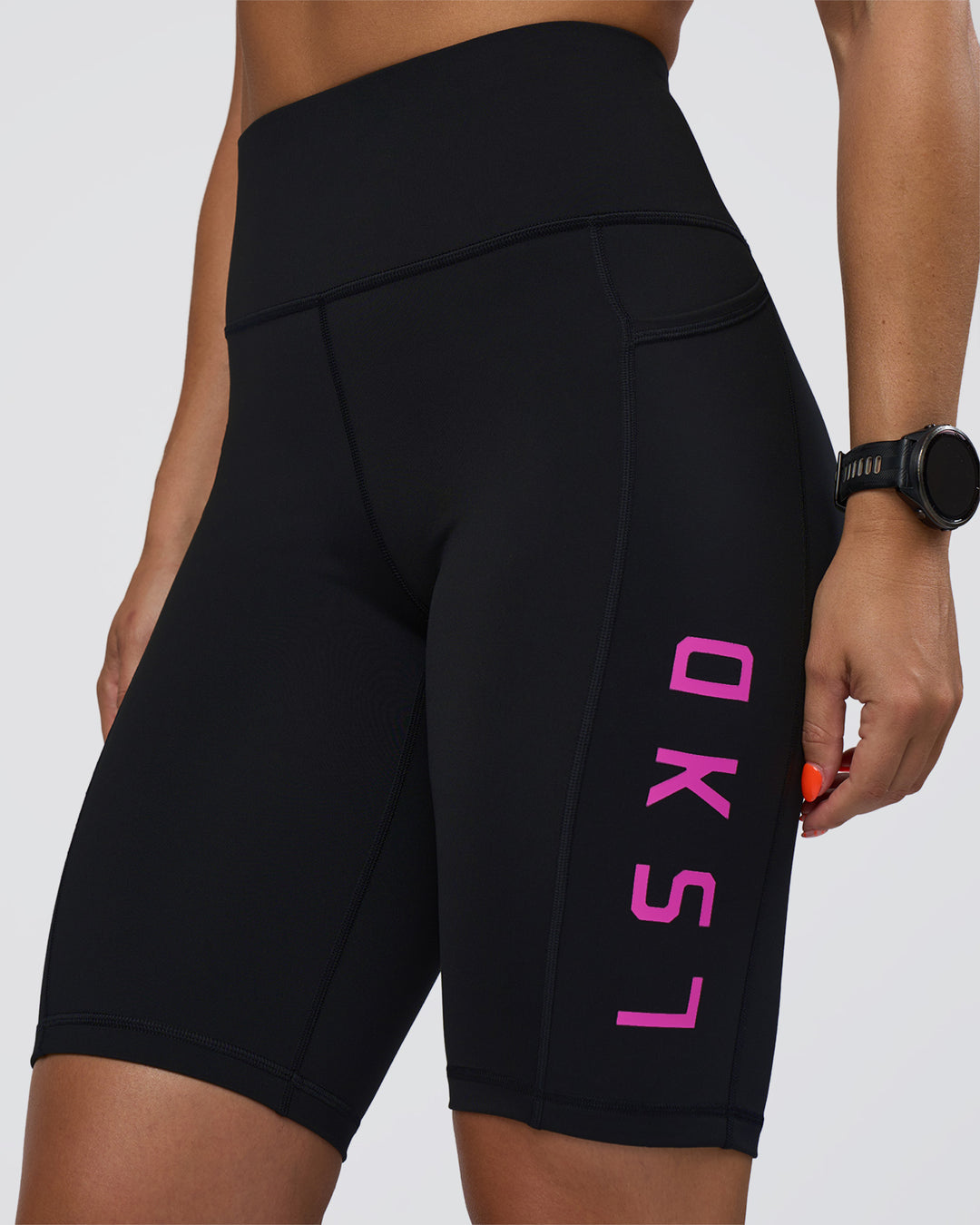 Woman wearing Rep Ultra High-Rise 9" Short Pockets - Black-Ultra Fuchsia | Model:Abbey | Size:S