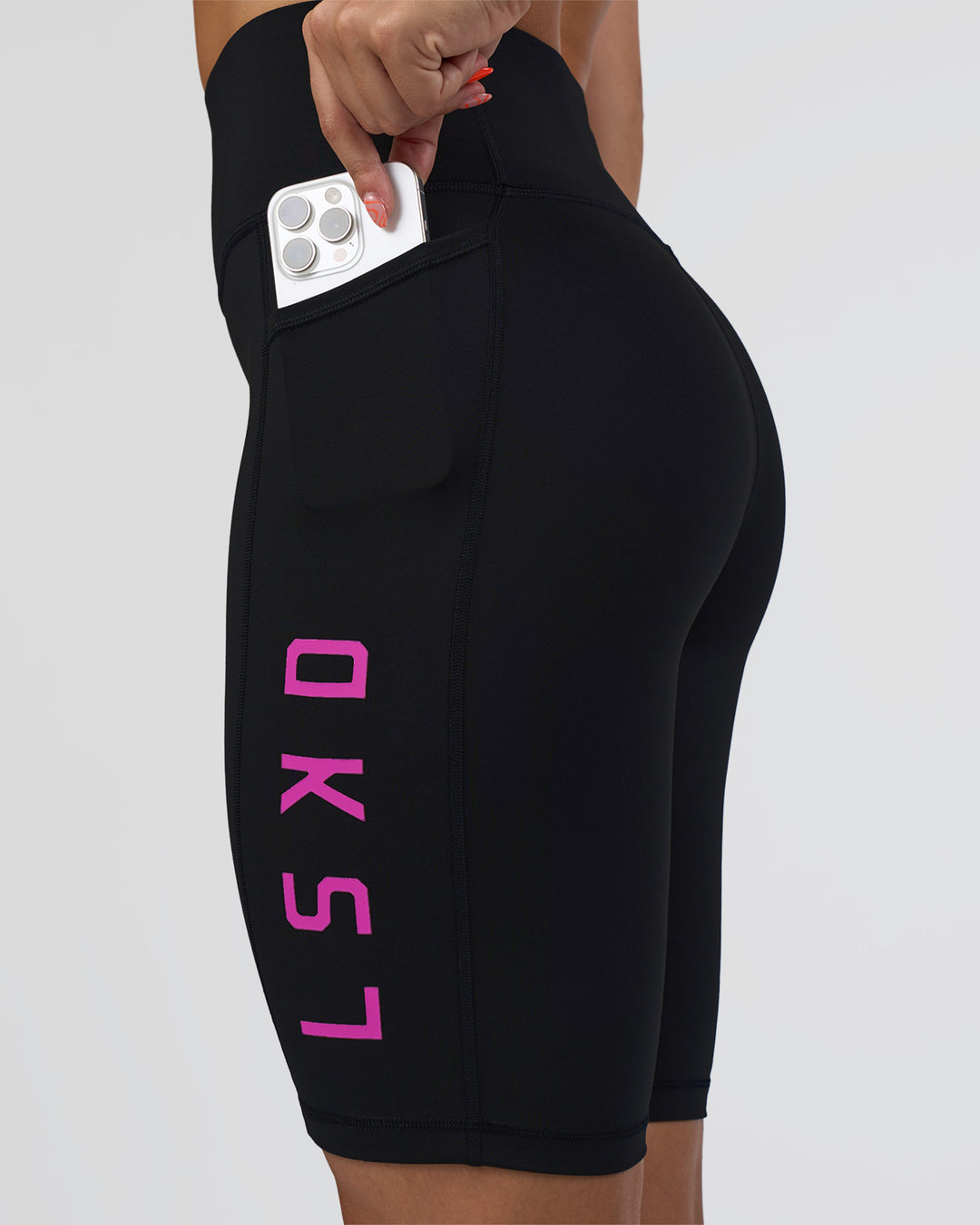 Woman wearing Rep Ultra High-Rise 9" Short Pockets - Black-Ultra Fuchsia | Model:Abbey | Size:S