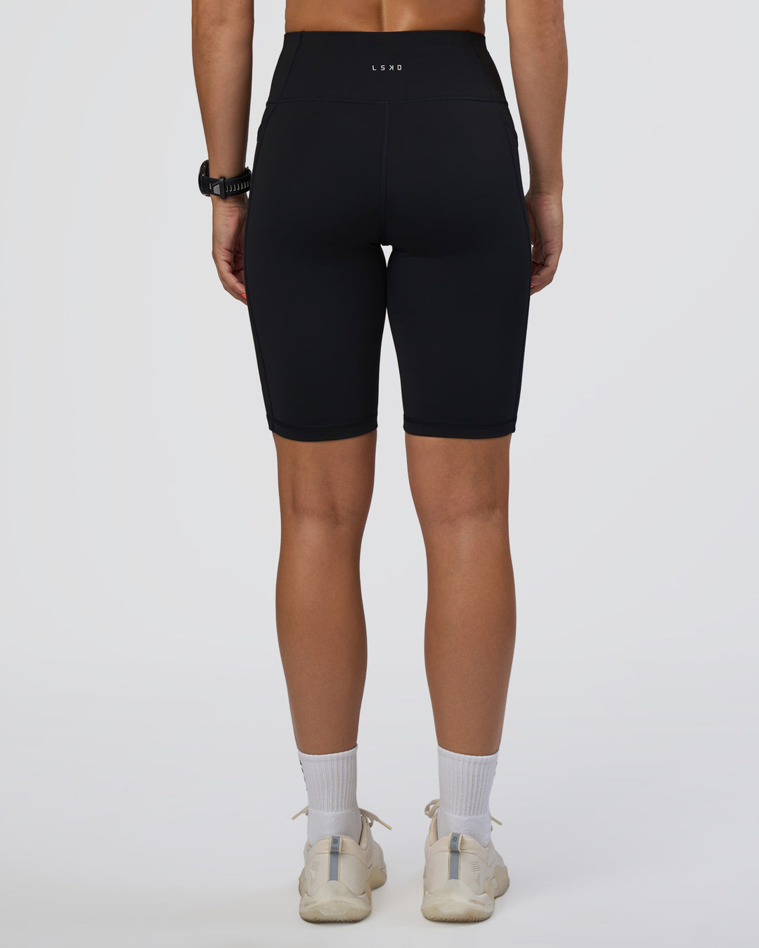 Woman wearing Rep Ultra High-Rise 9" Short Pockets - Black-Ultra Fuchsia | Model:Abbey | Size:S