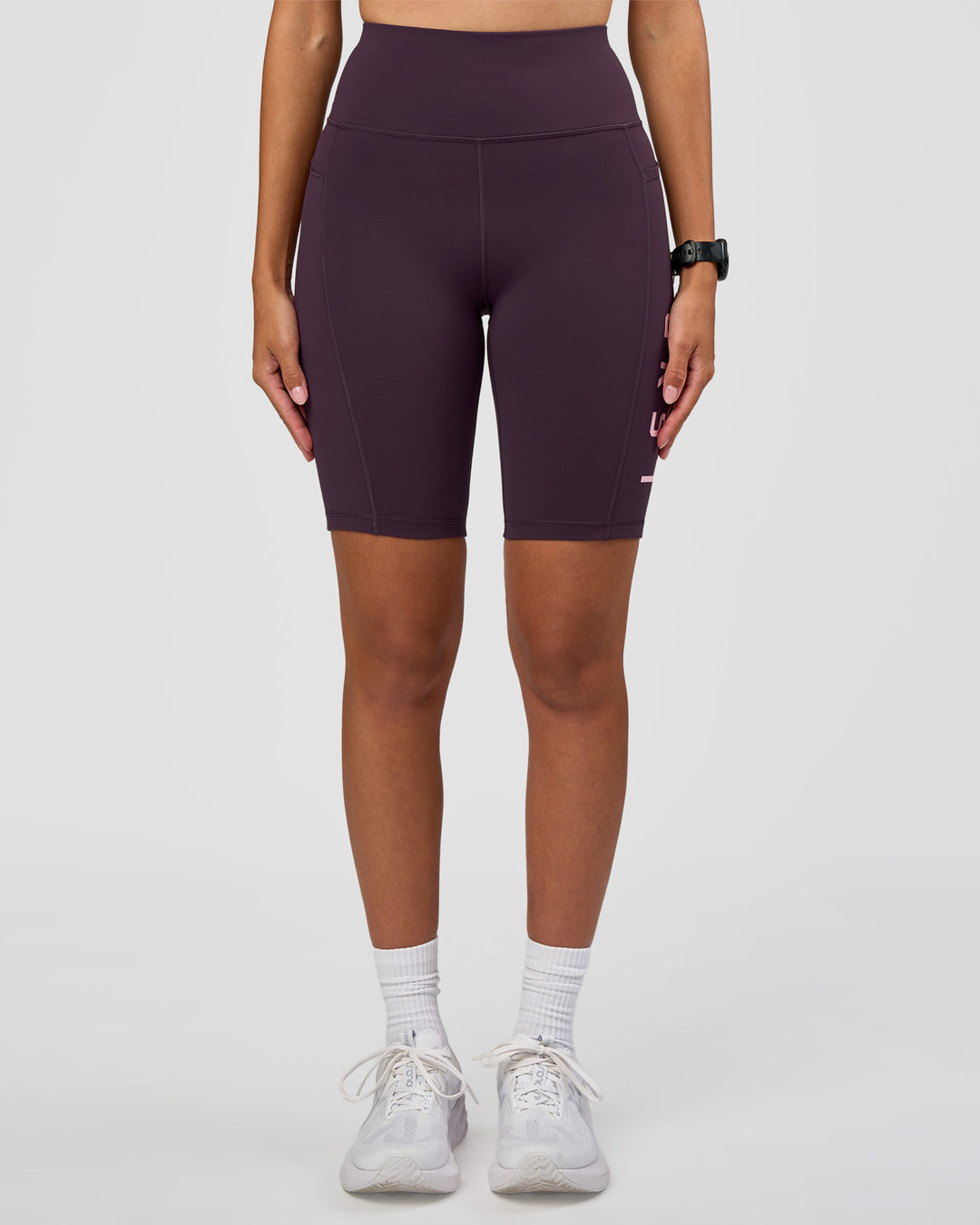 Woman wearing Rep Ultra High-Rise 9" Short Pockets - Midnight Plum-Marshmallow | Model:Rhiley | Size:S