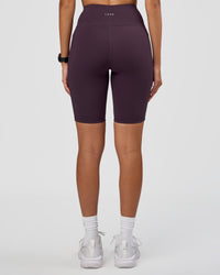 Woman wearing Rep Ultra High-Rise 9" Short Pockets - Midnight Plum-Marshmallow | Model:Rhiley | Size:S