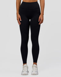 Woman wearing Rep Ultra High-Rise Full Length Legging Pockets - Black-Palace Blue | Model:Amity | Size:S