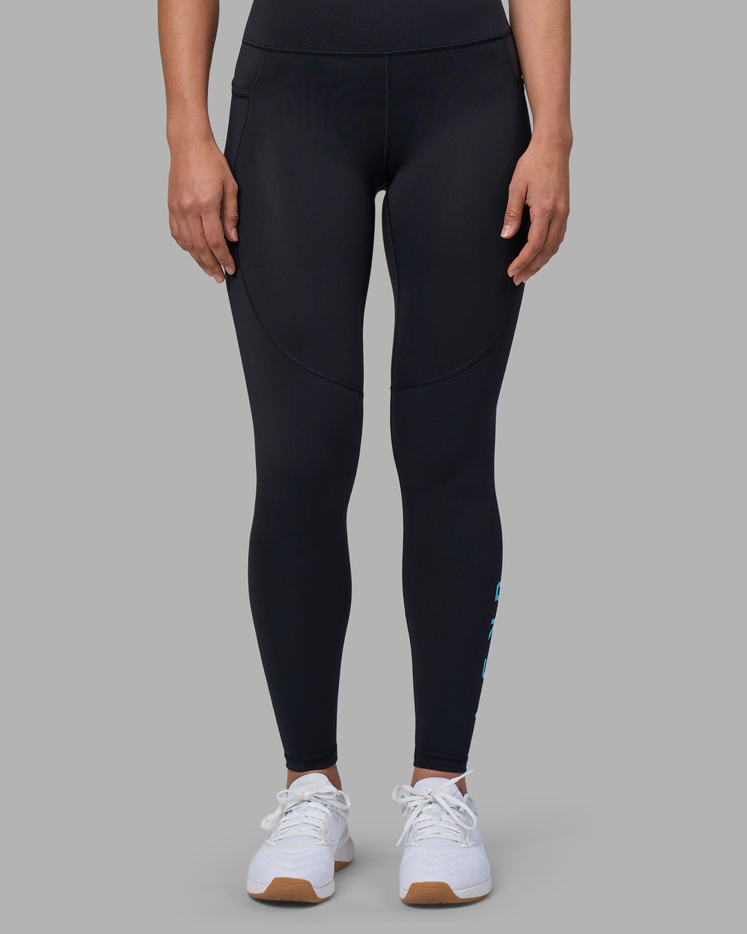 Woman wearing Rep Ultra High-Rise Full Length Legging Pockets - Black-Blue Atoll | Model:Sophie | Size:S