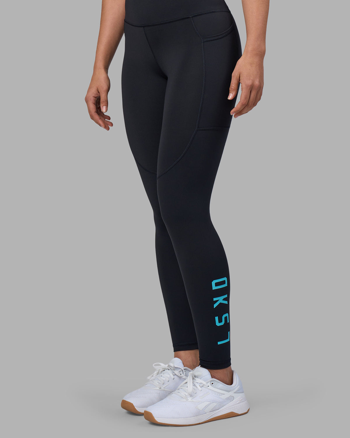 Woman wearing Rep Ultra High-Rise Full Length Legging Pockets - Black-Blue Atoll | Model:Sophie | Size:S