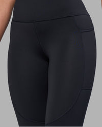 Woman wearing Rep Ultra High-Rise Full Length Legging Pockets - Black-Blue Atoll | Model:Sophie | Size:S