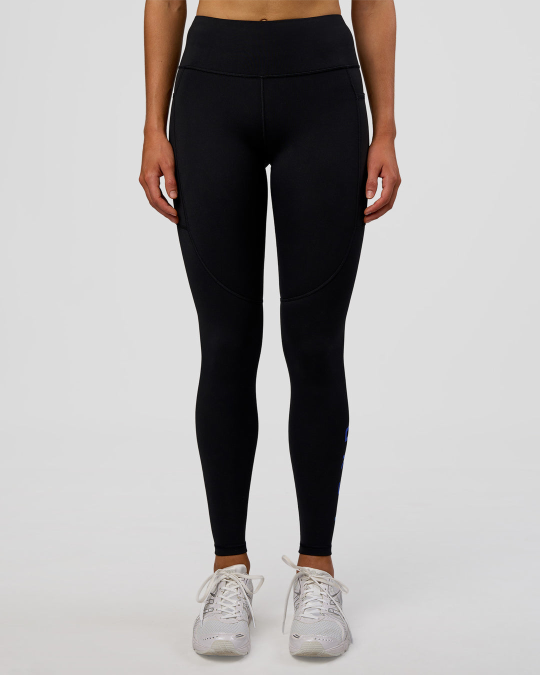 Woman wearing Rep Ultra High-Rise Full Length Legging Pockets - Black-Electric Indigo | Model:Evie | Size:S