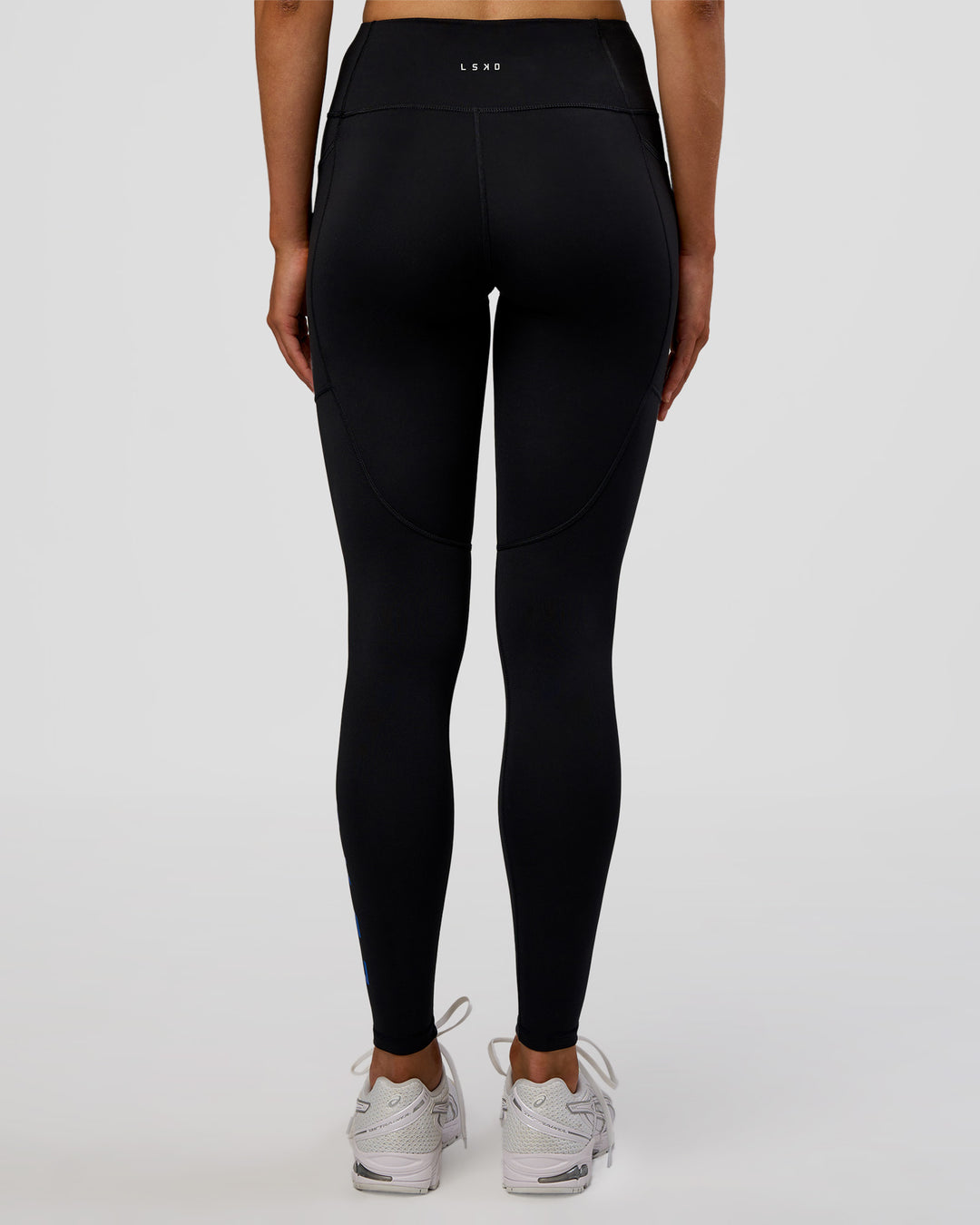 Woman wearing Rep Ultra High-Rise Full Length Legging Pockets - Black-Electric Indigo | Model:Evie | Size:S