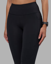 Woman wearing Rep Ultra High-Rise Full Length Legging Pockets - Black-Power Cobalt | Model:Rhiley | Size:S