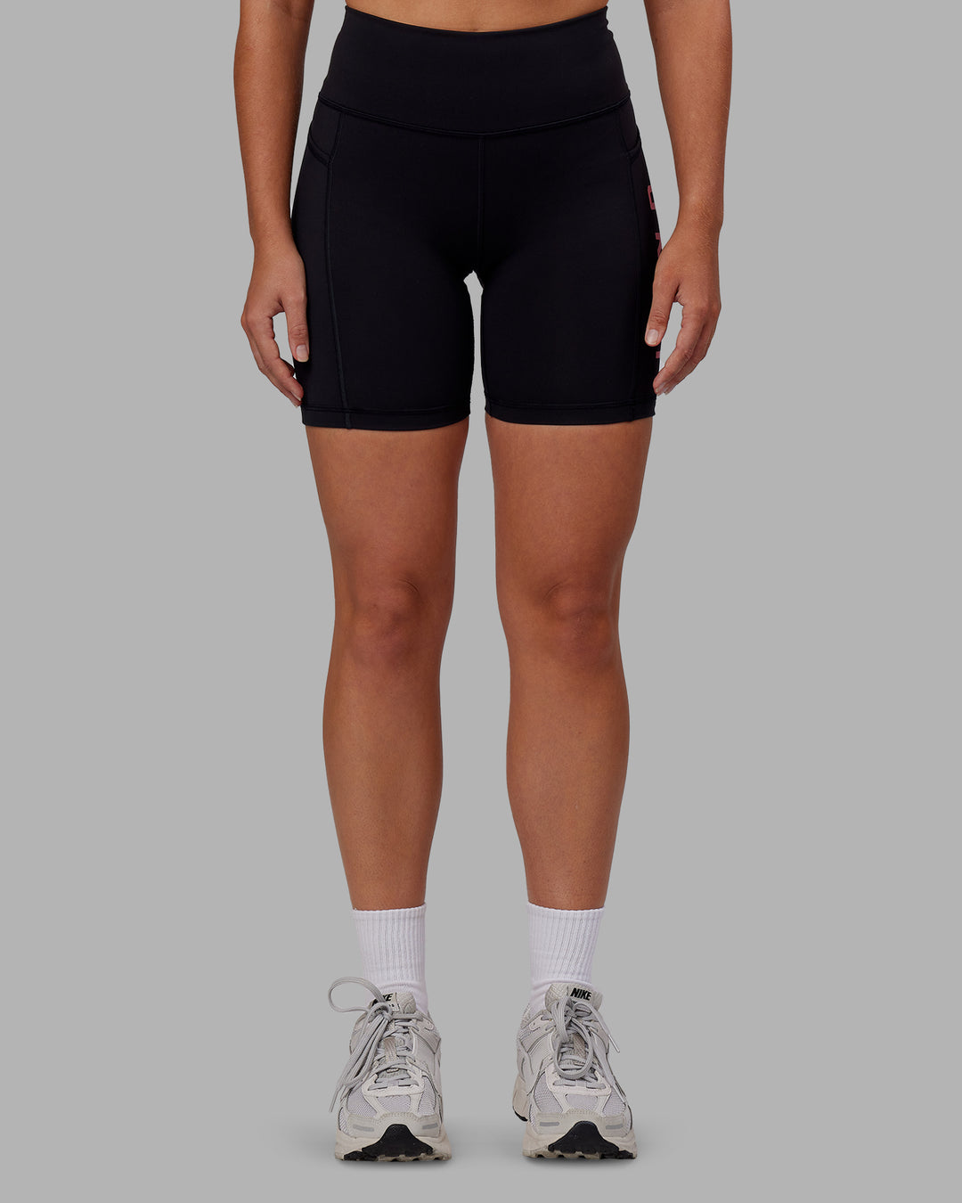 Woman wearing Rep Ultra High-Rise 6&quot; Short Pockets - Black-Pink Lemonade | Model:Hannah | Size:S
