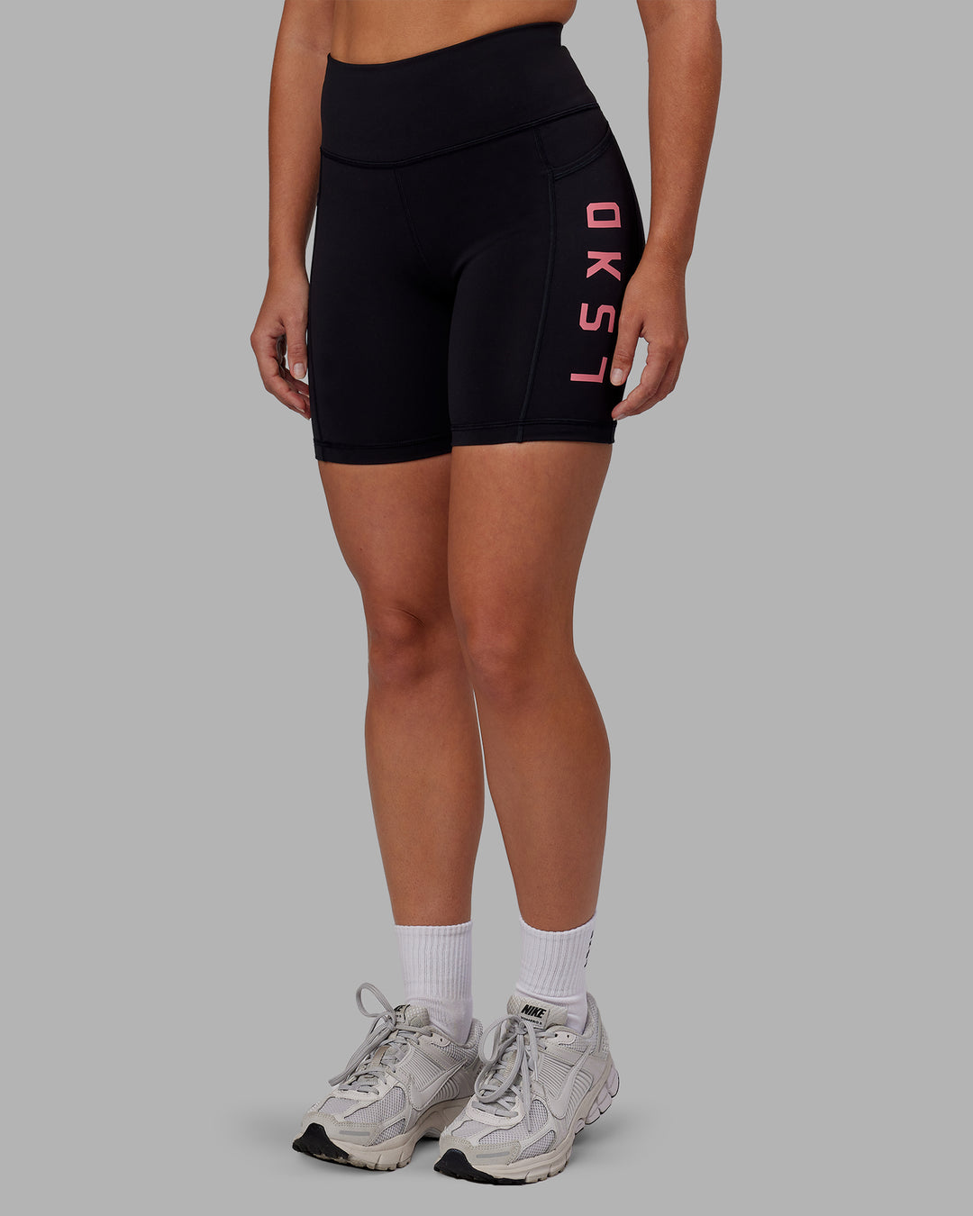 Woman wearing Rep Ultra High-Rise 6&quot; Short Pockets - Black-Pink Lemonade | Model:Hannah | Size:S