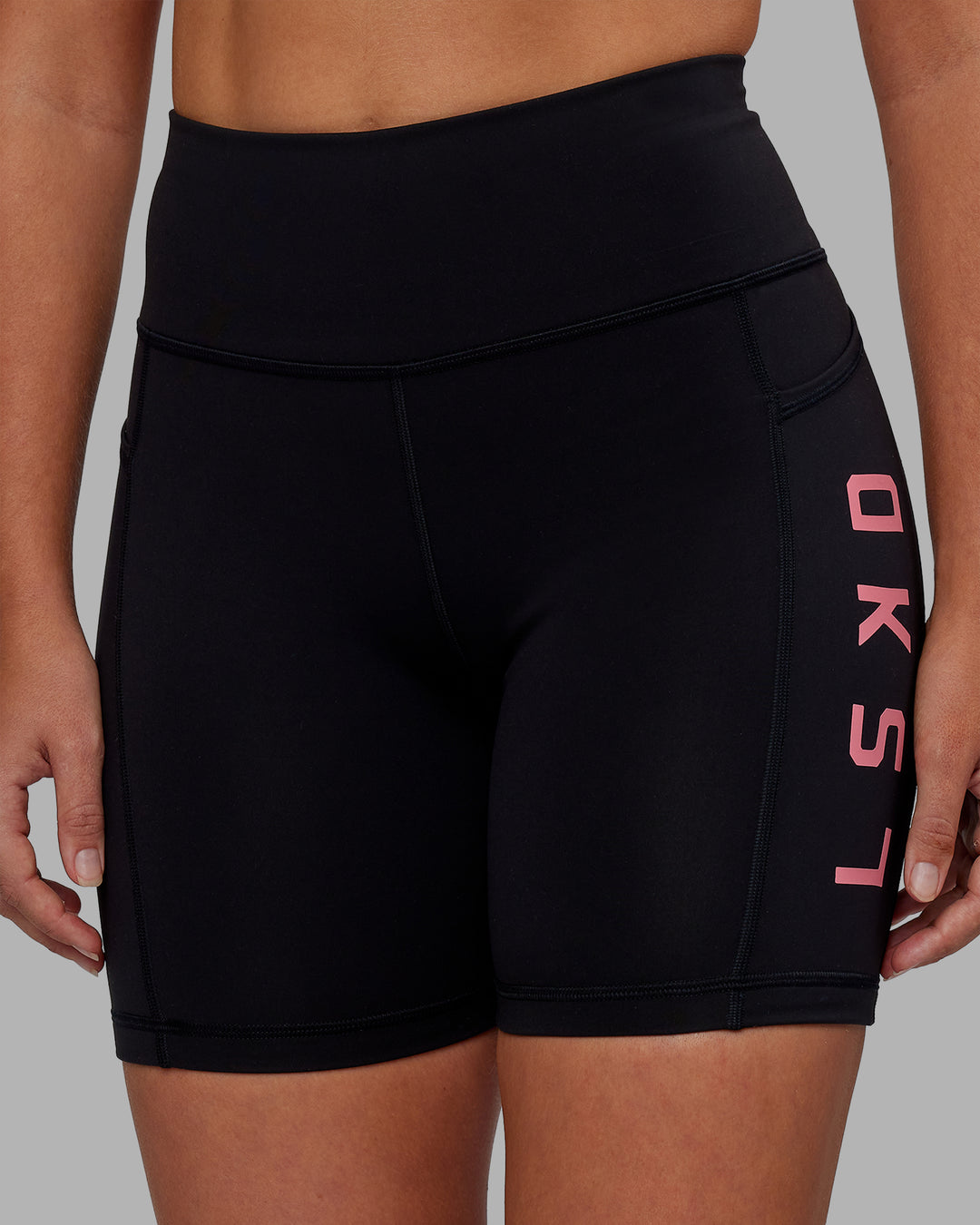 Woman wearing Rep Ultra High-Rise 6&quot; Short Pockets - Black-Pink Lemonade | Model:Hannah | Size:S