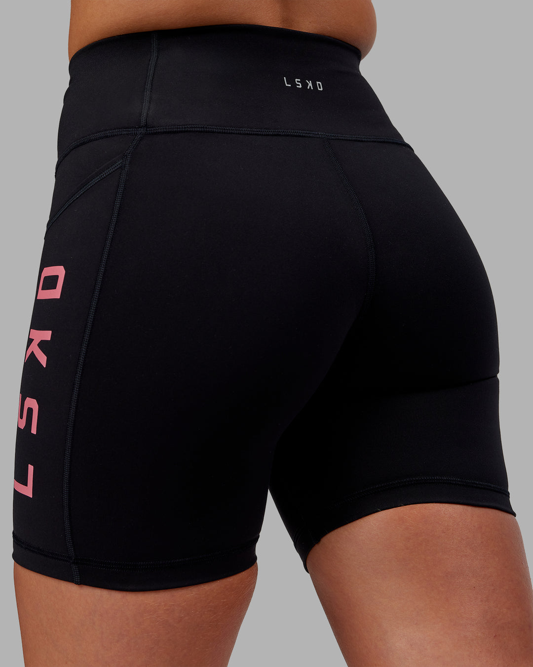 Woman wearing Rep Ultra High-Rise 6&quot; Short Pockets - Black-Pink Lemonade | Model:Hannah | Size:S