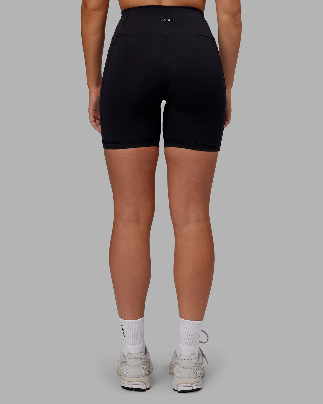 Woman wearing Rep Ultra High-Rise 6&quot; Short Pockets - Black-Pink Lemonade | Model:Hannah | Size:S