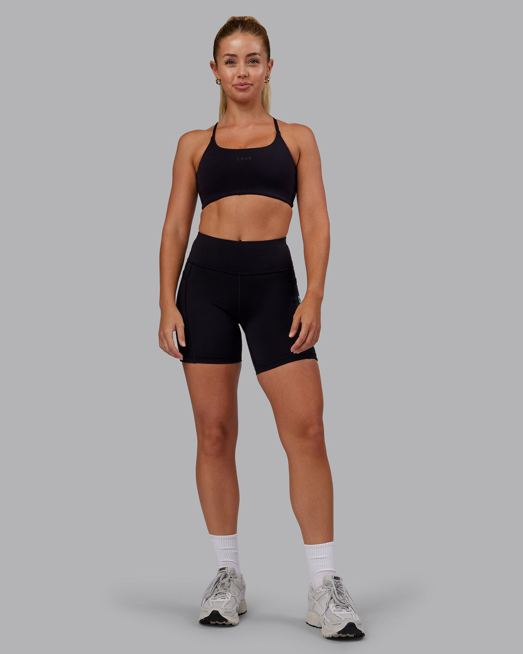 Woman wearing Rep Ultra High-Rise 6&quot; Short Pockets - Black-Retro Blue | Model:Hannah | Size:S