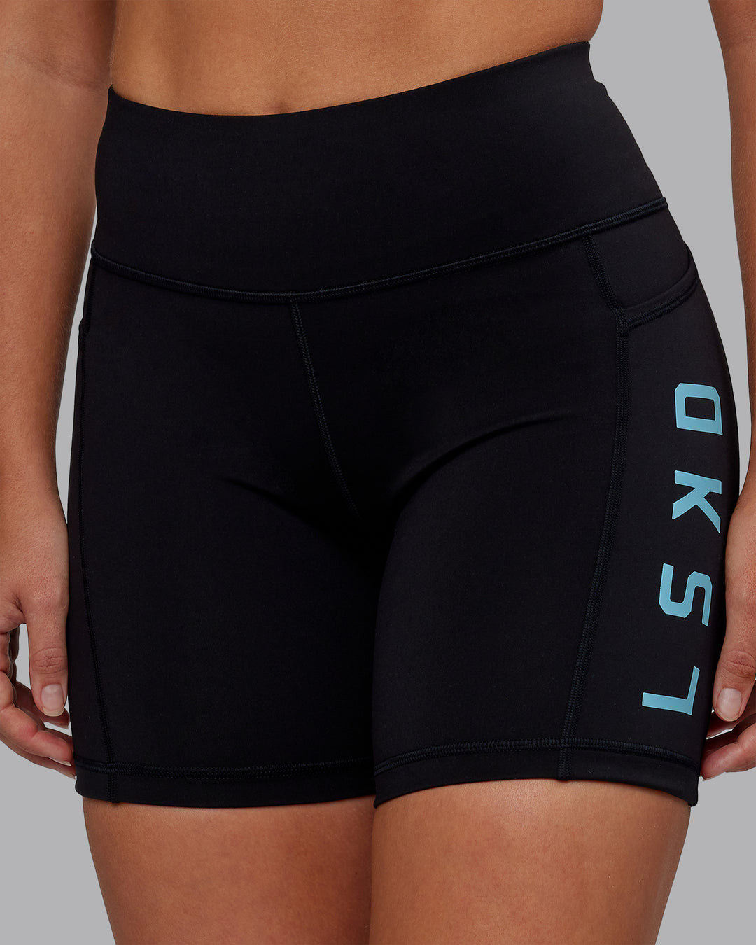 Woman wearing Rep Ultra High-Rise 6&quot; Short Pockets - Black-Retro Blue | Model:Hannah | Size:S