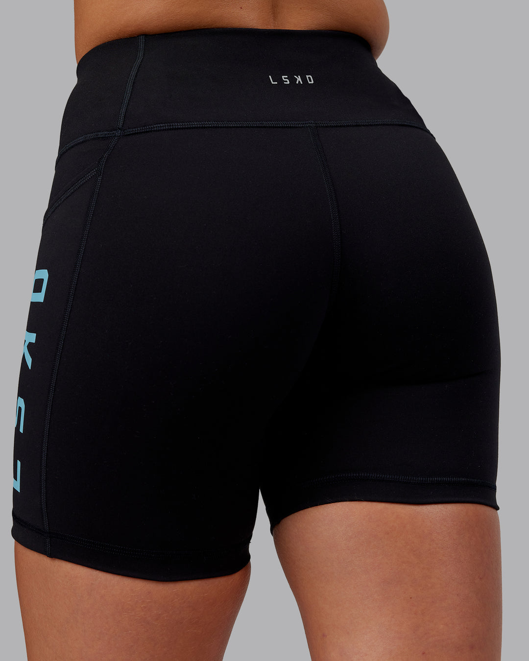 Woman wearing Rep Ultra High-Rise 6&quot; Short Pockets - Black-Retro Blue | Model:Hannah | Size:S