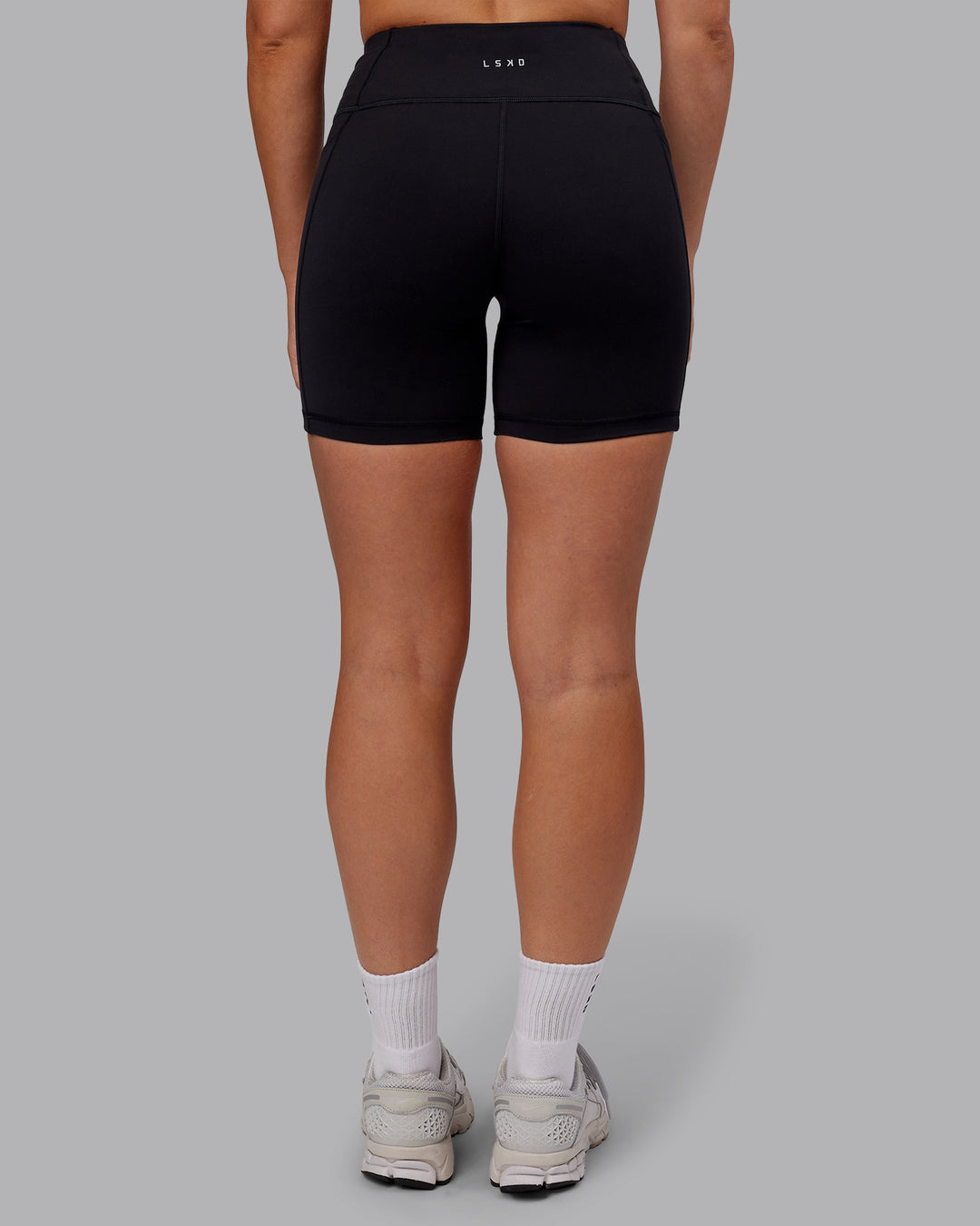 Woman wearing Rep Ultra High-Rise 6&quot; Short Pockets - Black-Retro Blue | Model:Hannah | Size:S