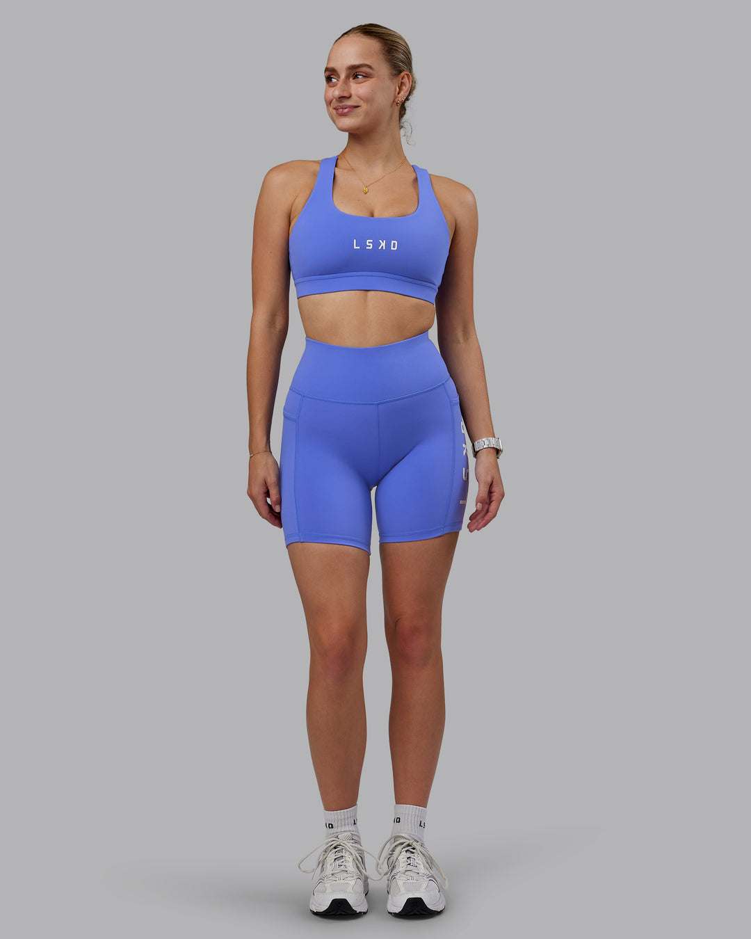 Woman wearing Rep Ultra High-Rise 6&quot; Short Pockets - Baja Blue-White | Model:Lillie | Size:S