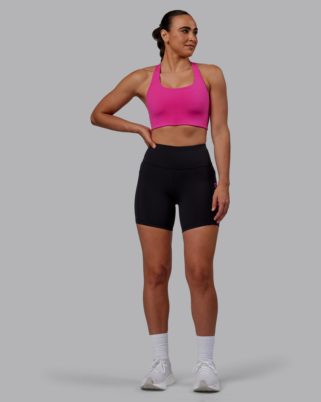 Woman wearing Rep Ultra High-Rise 6&quot; Short Pockets - Black-Fuchsia Pink | Model:Sophie | Size:S