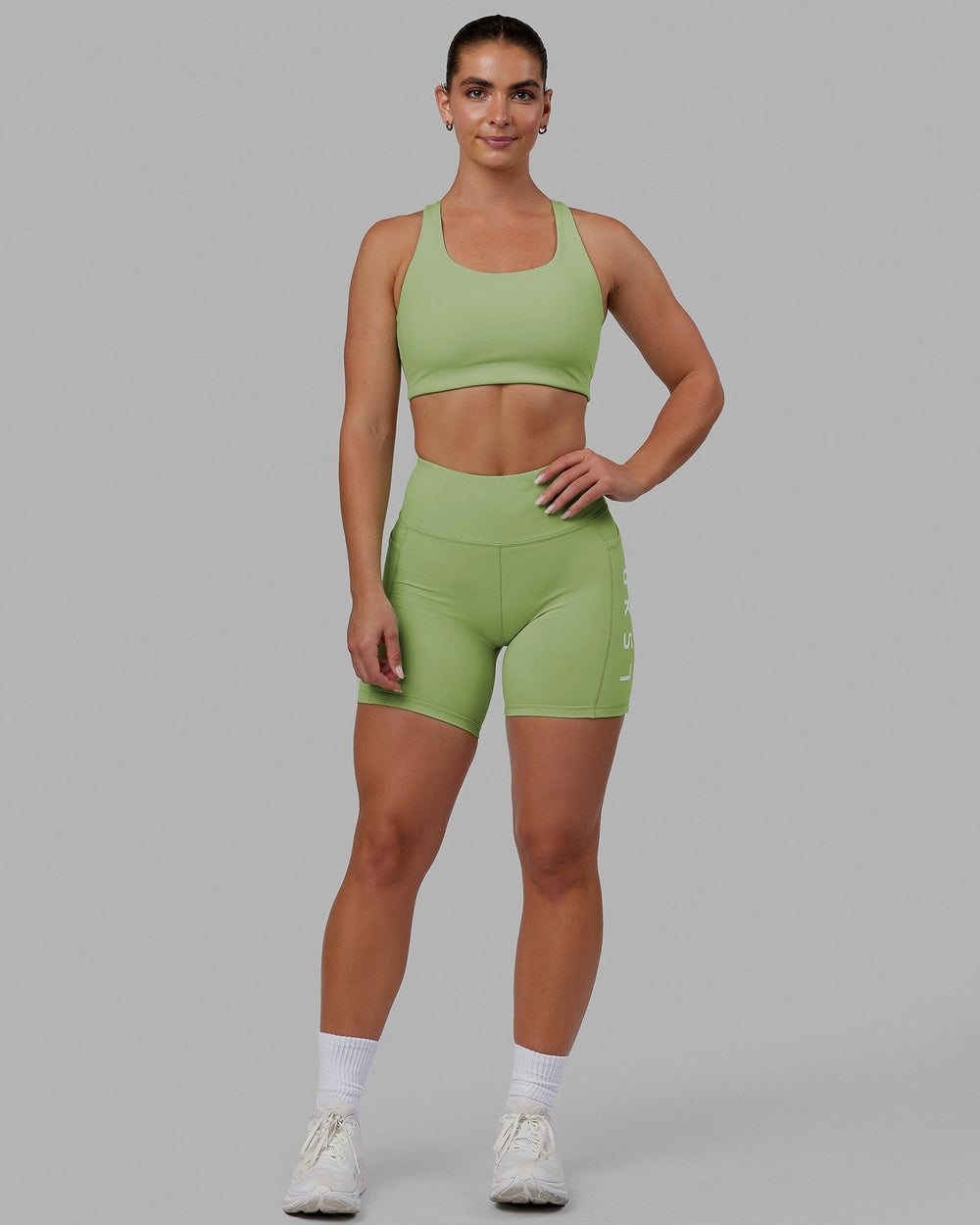 Woman wearing Rep Mid Short Tights - Green Fig