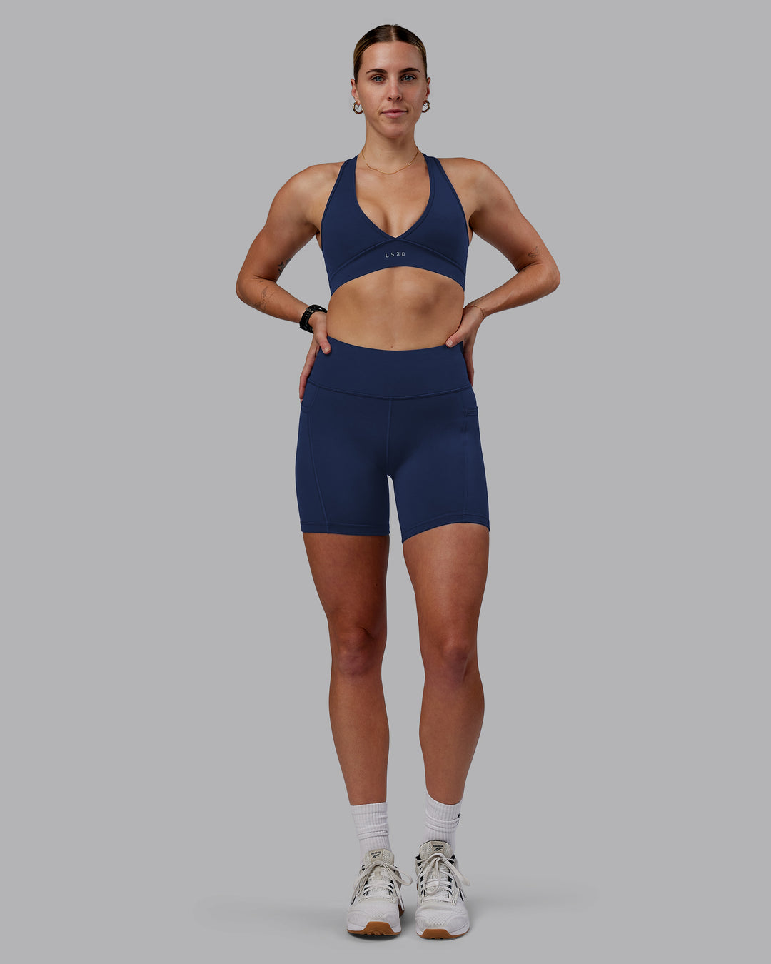 Woman wearing Rep Ultra High-Rise 6&quot; Short Pockets No Logo - Future Navy | Model:Shae | Size:S
