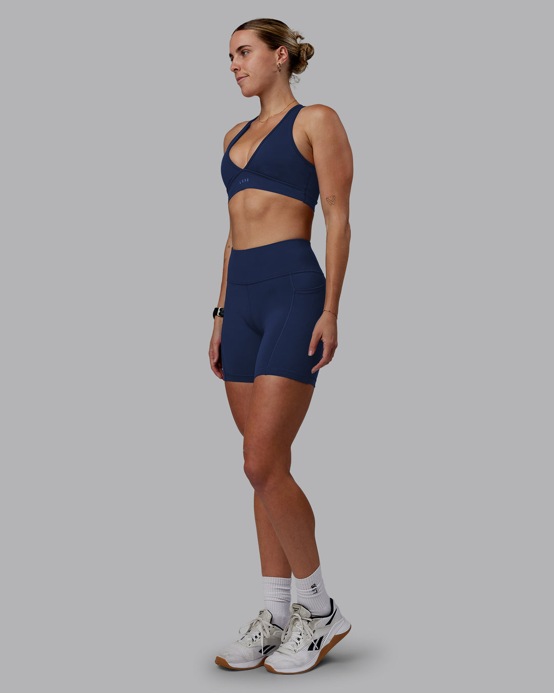 Woman wearing Rep Ultra High-Rise 6&quot; Short Pockets No Logo - Future Navy | Model:Shae | Size:S