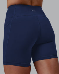 Woman wearing Rep Ultra High-Rise 6" Short Pockets No Logo - Future Navy | Model:Shae | Size:S