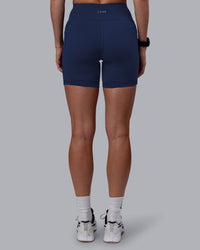 Woman wearing Rep Ultra High-Rise 6" Short Pockets No Logo - Future Navy | Model:Shae | Size:S